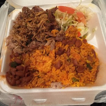 Caribbean Cafe - Yellow rice with red beans side of salad and pernil!!! - Caribbean Near Me - New Brunswick, New Jersey