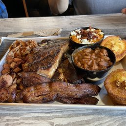 Pulled pork,(amazing) ribs, pork belly, bacon, andouille sausage, sweet mashed potatoes, corn bread and beans.. beans amazing!! Pulled pork,(amazing) ribs, pork belly, bacon, andouille sausage, sweet mashed potatoes, corn bread and beans.. beans amazing!!