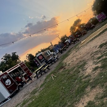 Foodie Trucks Park - a sunset in the background - Food Trucks Near Me - Katy, Texas Foodie Trucks Park - a sunset in the background - Food Trucks Near Me - Katy, Texas