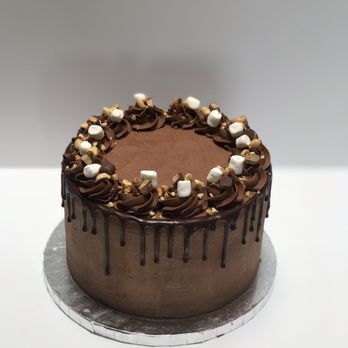 Hollieday Sweets - a chocolate cake with marshmallows on top - Bakeries Near Me Hollieday Sweets - a chocolate cake with marshmallows on top - Bakeries Near Me