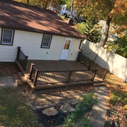 Distinctive Decks - Fiberon brown stone decking with stainless steel hidden clips  Rail Timbertech impressions  Black