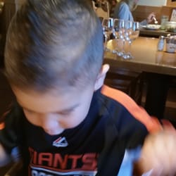 Great Clips - They got this wiggle worm to sit still and get a good faux hawk.