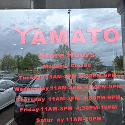 Yamato Sushi & Steakhouse - Door w/ restaurant hours