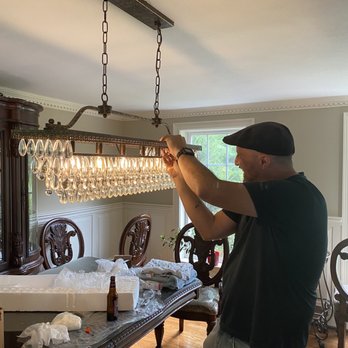 David Cassidy Master Electrician - David installing new dining room light - Electricians Near Me