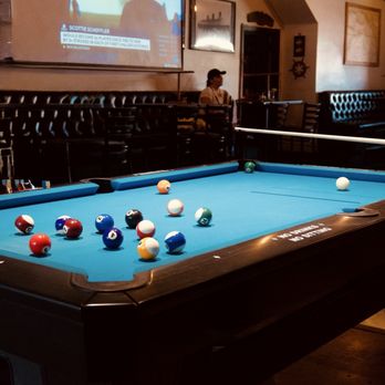 Port City Tavern - Main pool table (takes dollar bills). C'est la vie to stacking quarters on the edges to secure your spot. - Cocktail Bars Near Me - Long Beach, California Port City Tavern - Main pool table (takes dollar bills). C'est la vie to stacking quarters on the edges to secure your spot. - Cocktail Bars Near Me - Long Beach, California