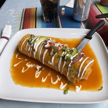 Casa Del Mariachi - Dry Burrito with Meat, red salsa on top. - Mexican Near Me - Seattle, Washington Casa Del Mariachi - Dry Burrito with Meat, red salsa on top. - Mexican Near Me - Seattle, Washington