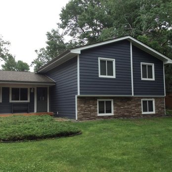 Croixside Home Improvements - So we replaced the siding with a slate vinyl siding and white trim..notice the Versetta Stone instead of brick - Windows Installation Near Me - Hudson, Wisconsin