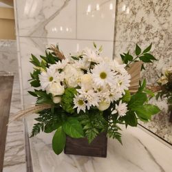 Floral Matters - Creative design in a wooden box with daisies both represent a 5th wedding anniversary