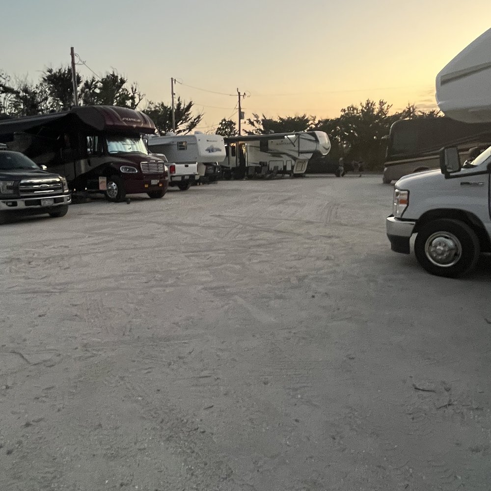Sugar Sand Beach RV Resort - Parking lot they call this a RV sites - RV Parks Near Me - Matlacha, Florida Sugar Sand Beach RV Resort - Parking lot they call this a RV sites - RV Parks Near Me - Matlacha, Florida