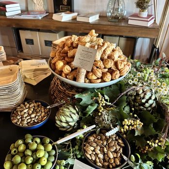 Vinoce - a variety of food displayed on a table - Wine Bars Near Me - Napa, California