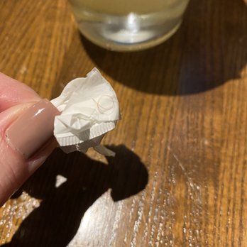 TGI Fridays West Orange - a hand holding a piece of paper next to a glass of milk - Burgers Near Me - West Orange, New Jersey