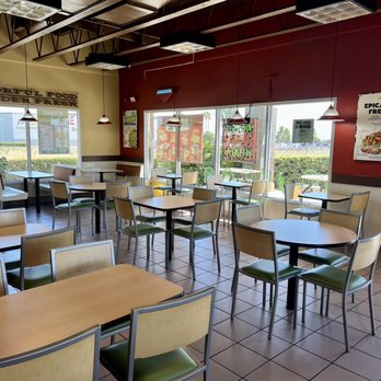 Del Taco - empty tables and chairs in a restaurant - Fast Food Near Me - Ontario, California Del Taco - empty tables and chairs in a restaurant - Fast Food Near Me - Ontario, California