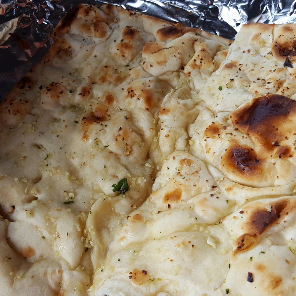 Taj E India - a close up of a flat bread - Indian Near Me - White River Junction, Vermont Taj E India - a close up of a flat bread - Indian Near Me - White River Junction, Vermont