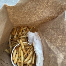 a paper bag full of french fries