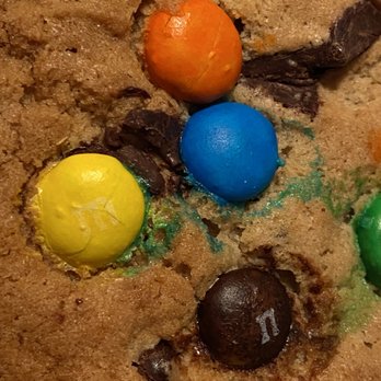 Avventura Bakery & Deli - Close-up of the giant chocolate chip and M&Ms cookie. - Delis Near Me - Southington, Connecticut Avventura Bakery & Deli - Close-up of the giant chocolate chip and M&Ms cookie. - Delis Near Me - Southington, Connecticut