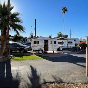 Twin Palms Rv Park - Gravel parking area with small grass area, and utility light. - RV Parks Near Me - Mesa, Arizona Twin Palms Rv Park - Gravel parking area with small grass area, and utility light. - RV Parks Near Me - Mesa, Arizona