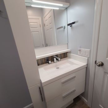 LMR Services - a bathroom with a sink and mirror - General Contractors Near Me LMR Services - a bathroom with a sink and mirror - General Contractors Near Me