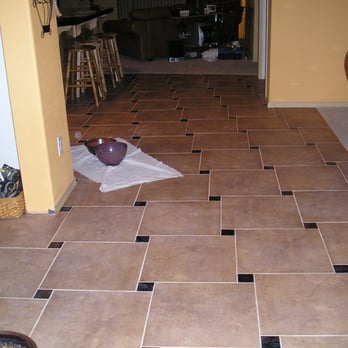 Tile Tech - I love the way that big tile pin-wheels around the black granite squares and directs you to the TV room. 3D - Tiling Near Me Tile Tech - I love the way that big tile pin-wheels around the black granite squares and directs you to the TV room. 3D - Tiling Near Me
