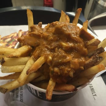 NYF - a bowl of french fries with sauce - Fast Food Near Me - Edmonton, Alberta NYF - a bowl of french fries with sauce - Fast Food Near Me - Edmonton, Alberta