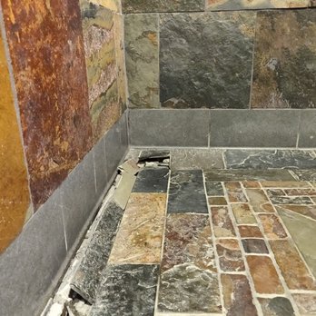 DiCicco's - Sunken men's restroom floor showing sheared flooring and clay soils below. - Italian Near Me - Denver, Colorado DiCicco's - Sunken men's restroom floor showing sheared flooring and clay soils below. - Italian Near Me - Denver, Colorado