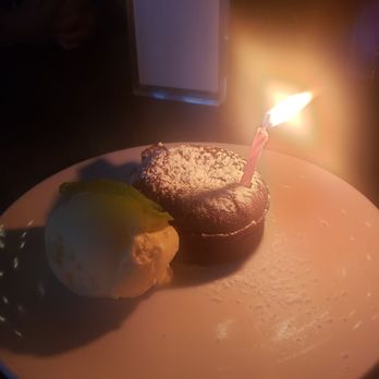 VERSA - Chocolate molten lava cake served with vanilla ice cream. - New American Near Me - New York, New York