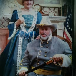 Notice the Union flag in a Confederate photo. Also, the large crease across the front of the dress and the jacket.