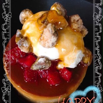 Hugo's - Flan de queso: Passion fruit glaze with roasted caramelized pistashios on top - Mexican Near Me - Houston, Texas