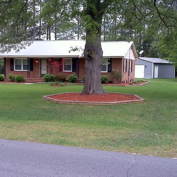 Waybetter Landscaping - This is a yard layed with centipede sod and fresh red mulch. - Lawn Services Near Me - Raeford, North Carolina Waybetter Landscaping - This is a yard layed with centipede sod and fresh red mulch. - Lawn Services Near Me - Raeford, North Carolina