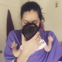 Leche de Coco - Client carrying her baby.