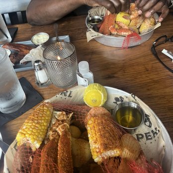 Pearl Tavern - Seafood boil. With crab, potatoes, sausage, shrimp and corn. - New American Near Me - Lee's Summit, Missouri Pearl Tavern - Seafood boil. With crab, potatoes, sausage, shrimp and corn. - New American Near Me - Lee's Summit, Missouri