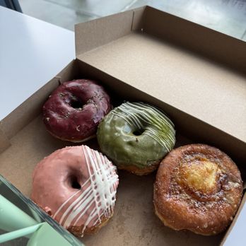 Magic Donuts & Coffee - (From the top) blueberry lime, matcha, creme brulee, and blood orange - Donuts Near Me - San Francisco, California Magic Donuts & Coffee - (From the top) blueberry lime, matcha, creme brulee, and blood orange - Donuts Near Me - San Francisco, California
