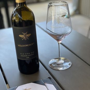 Meadowcroft Wines - a wine glass and bottle on a table - Wineries Near Me - Sonoma, California Meadowcroft Wines - a wine glass and bottle on a table - Wineries Near Me - Sonoma, California