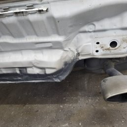Rear body panel left cracked, dented, crumbling -not even the support bar that between this part of the car and the rear bumper left hanging