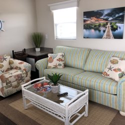 The Bungalows at Village West Marina & Resort - The Delta Bungalow features coastal decor along with original paintings by local artist.