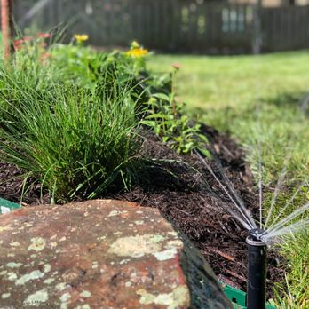 Elevated Living - a sprinkler in a garden - Landscaping Near Me Elevated Living - a sprinkler in a garden - Landscaping Near Me