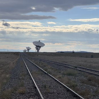 The Very Large Array Visitor Center - Almost surreal via of some of the array dish antennae and the rails they move on - Visitor Centers Near Me - Magdalena, New Mexico