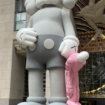 Rockefeller Center - Share Sculpture by Kaws - "Companion" and "BFF" - Shopping Centers Near Me - New York, New York