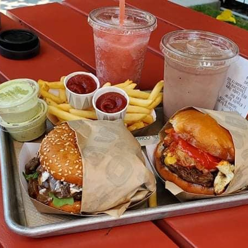 Gott's St. Helena - California burger (left) and Kimchi burger (right). There's also the Frose (left) and chocolate+strawberry shake (right) in the back. - Burgers Near Me - Saint Helena, California Gott's St. Helena - California burger (left) and Kimchi burger (right). There's also the Frose (left) and chocolate+strawberry shake (right) in the back. - Burgers Near Me - Saint Helena, California