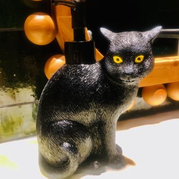 Le Coq - Wonderful black cat soap dispenser in men's room! - French Near Me - La Jolla, California