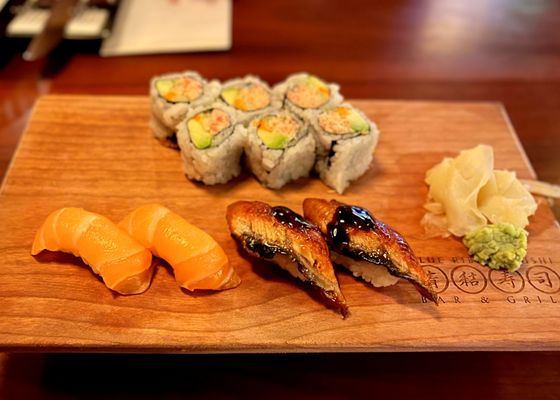 Photo of Blue Ribbon Sushi Bar & Grill - Red Rock - Las Vegas, NV, US. Salmon, eel, and real crab cali roll