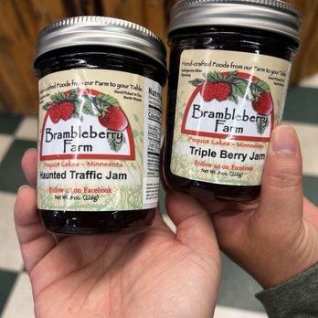 Lakes Latte - a hand holding two jars of jam - Coffee & Tea Near Me - Pequot Lakes, Minnesota Lakes Latte - a hand holding two jars of jam - Coffee & Tea Near Me - Pequot Lakes, Minnesota