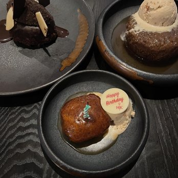 Gordon Ramsay Hell's Kitchen - Chocolate sin cake (back left) and sticky toffee pudding (back right) - Steakhouses Near Me - Stateline, Nevada