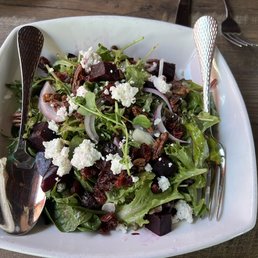 Salad with beets, dried cranberries, pecans, & goat cheese