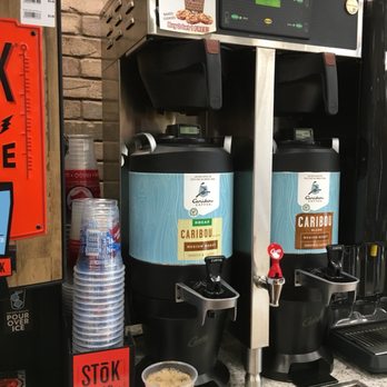 Exxon - a coffee machine with a cup of coffee next to it - Gas Stations Near Me - Fargo, North Dakota