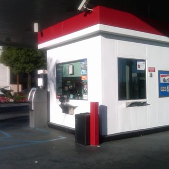 Apro 11 - a small white building with a red roof - Convenience Stores Near Me - San Pedro, California