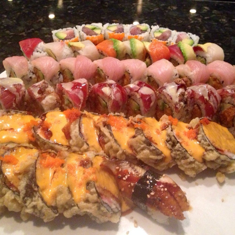 Fujiyama - Back to front: Osaka, Rainbow, White Swan, Tuna Amazing, Godzilla and a Uni Nigiri. - Sushi Bars Near Me - Milwaukee, Wisconsin Fujiyama - Back to front: Osaka, Rainbow, White Swan, Tuna Amazing, Godzilla and a Uni Nigiri. - Sushi Bars Near Me - Milwaukee, Wisconsin
