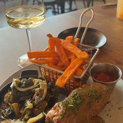 Meatloaf with collard greens and sweet potato fries with a light refreshing glass of Russian River wine.