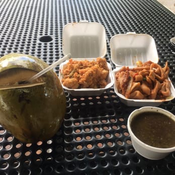El Palacio De Los Jugos - Calamari, lobster, black beans and my coco! The best thing here is the coco. Food is no good. - Fruits & Veggies Near Me - Miami, Florida