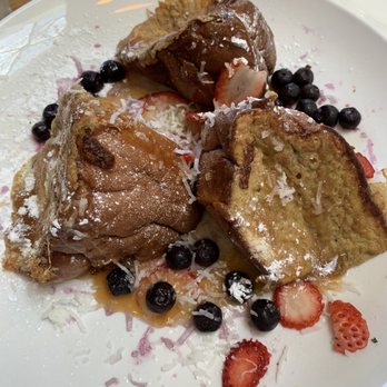 Broken Yolk Cafe - Tiki Toast!  I'd recommend asking for a side if the caramel sauce and more berries! - Breakfast & Brunch Near Me - Oceanside, California