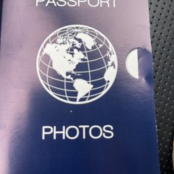 Booklet containing 2 correctly sized passport photos.